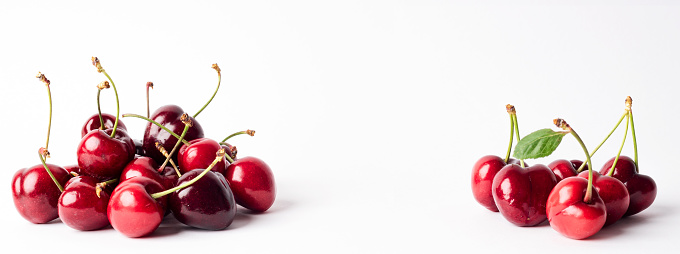 Banner with a set of rich and healthy red cherries on a white background. Freshly picked cherries wallpaper