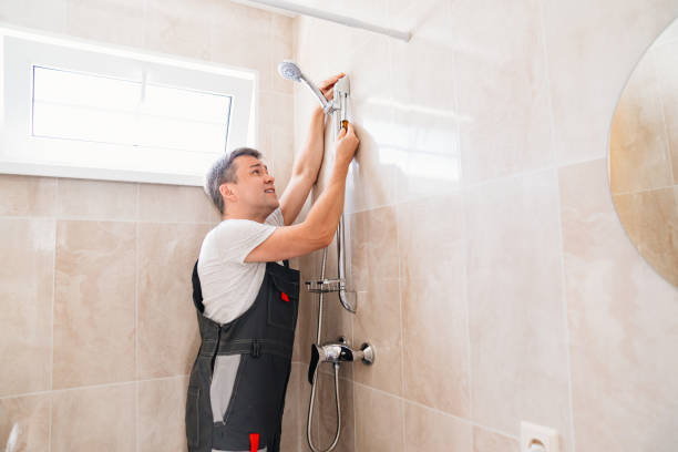 istock A master plumber installs a shower head in the bathroom. 1493456778