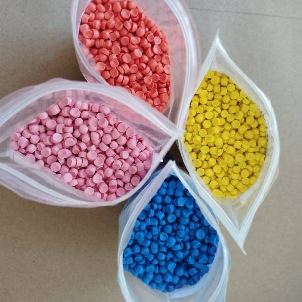 istock Polymer granules and plastic is pink, blue, yellow and orange colour. 1493458456
