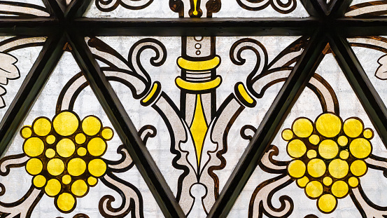 A section of a leaded stained glass window in an English church.