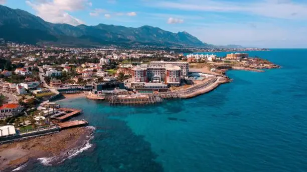 Aerial coastline of Kyrenia city in North Cyprus on sunny day with clear sky.