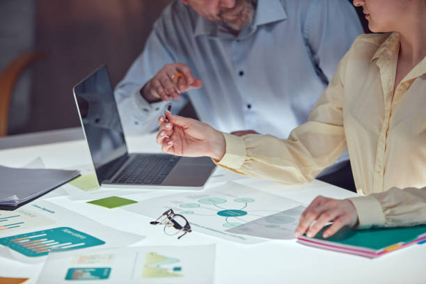 istock Beautiful business people are using gadgets and laptop, talking during the conference in office over meeting room background 1493465716