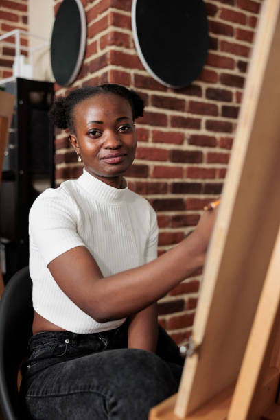 istock Happy girl studying at art school 1493467975