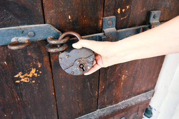 istock Old wooden door with rusty lock 1493471197