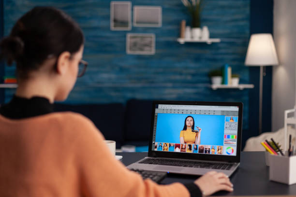 istock Student retouching photos on laptop. 1493471581