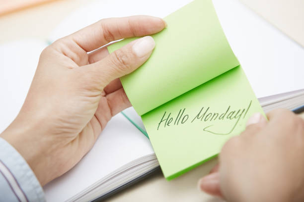 Hello Monday text on adhesive note stock photo