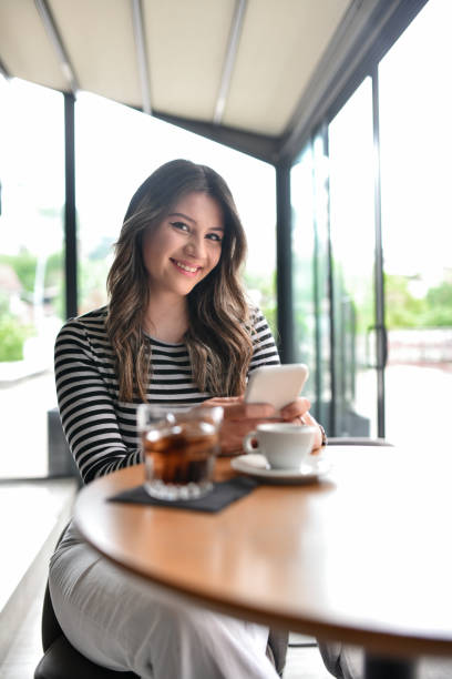 istock Cute Smiling Female Asking AI On Smartphone For Specific Answers 1493476449