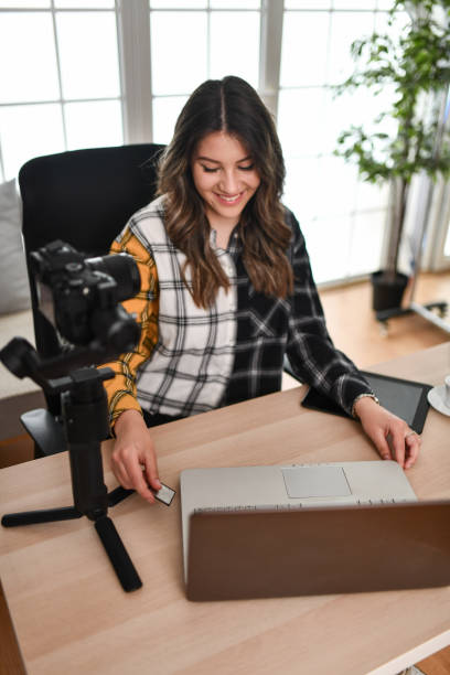 istock Smiling Female Photographer Ready To Transfer Photos And Work On Them 1493476764