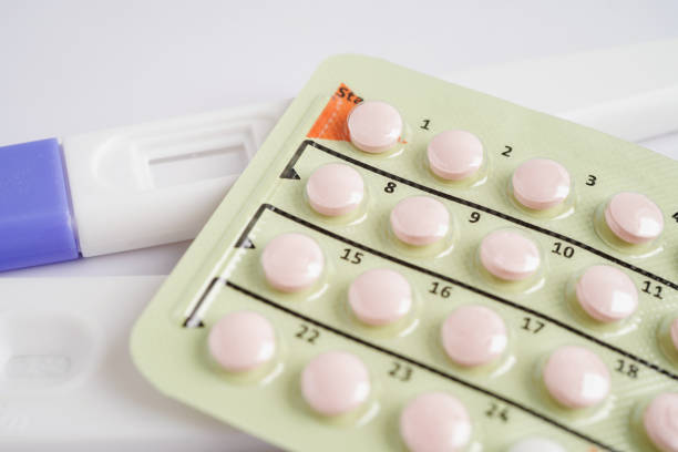 istock Pregnancy test with birth control pills for female on calendar, ovulation day. 1493478413