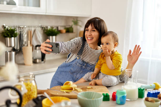 istock Mother taking Selfie with her baby boy in the kitchen 1493478843