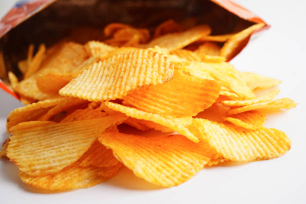 istock Potato chips in open bag, delicious BBQ seasoning spicy for crips, thin slice deep fried snack fast food. 1493480242