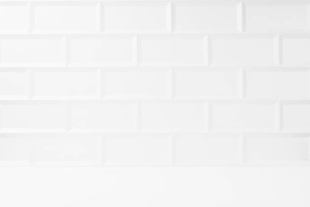 istock White abstract blank stage with white glossy ceramic rectangle tile wall, wood floor as mockup for presentation cosmetic products, goods, design. Abstract interior in modern simple style. 1493482581