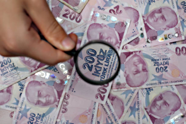 Turkish Lira Bill under Magnifying Glass Stock Photo, Focusing Two Hundred Lira Bill, Business concept TR Paper Currency, Lira sign, Turkish Two Hundred Lira Bill, Zoom Effect, Banking mediterranean ethnicity stock pictures, royalty-free photos & images