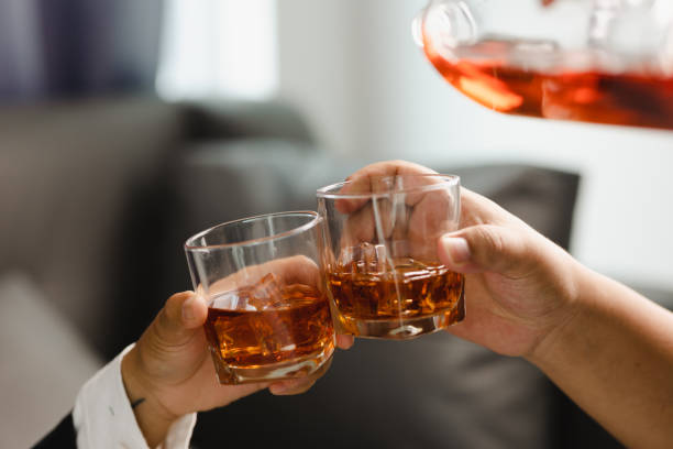 istock Young man holding whiskey glass in bar or restaurant. 1493486102