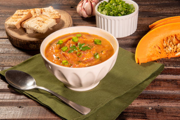 istock Homemade pumpkin cream, accompanied by spices. pumpkin broth 1493492954