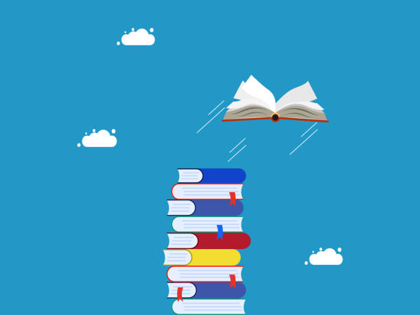 istock Freedom to learn. The book flew off the pile of books 1493496705