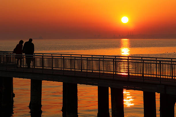 istock silhouettes of romantic couple 149349838