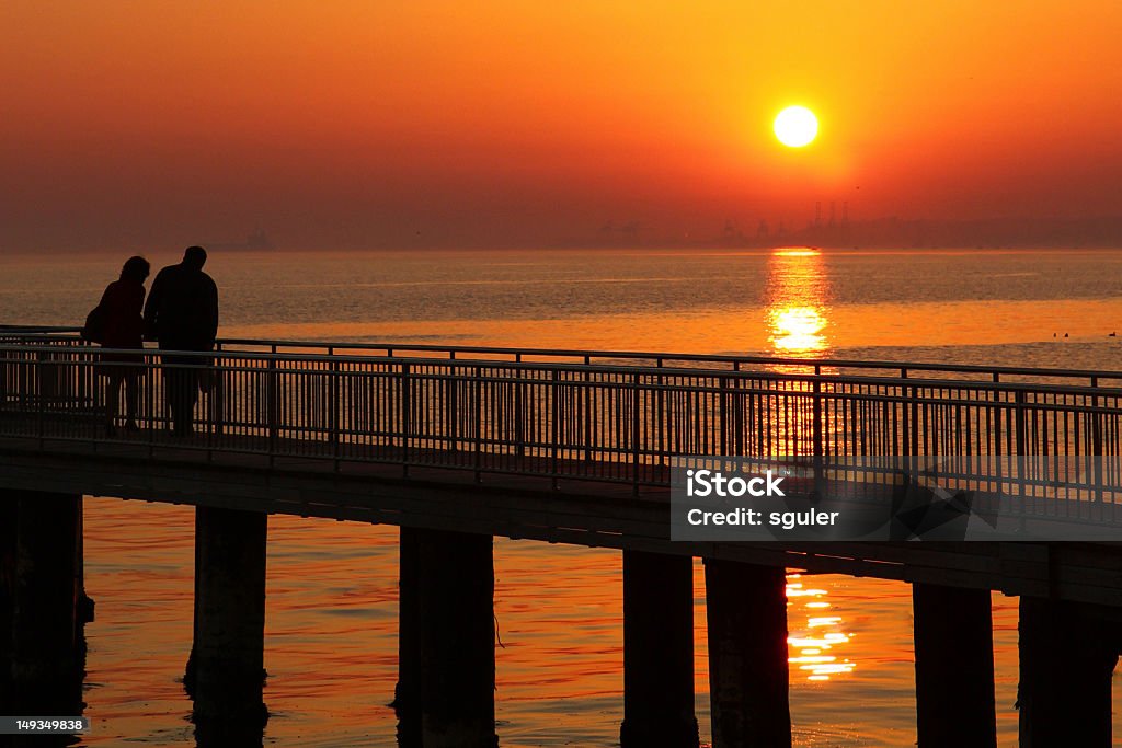 silhouettes of romantic couple silhouettes of romantic couples they are looking at sunset Active Seniors Stock Photo