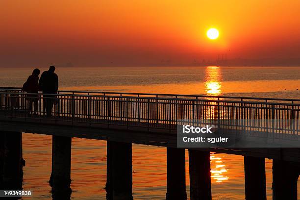 Silhouettes Of Romantic Couple Stock Photo - Download Image Now - Active Seniors, Adult, Adults Only