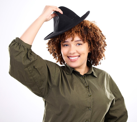 Black woman, smile and portrait with a hat in studio for fashion, style and happiness or beauty. Face of happy model person isolated white background with stylish head accessory, kindness and respect