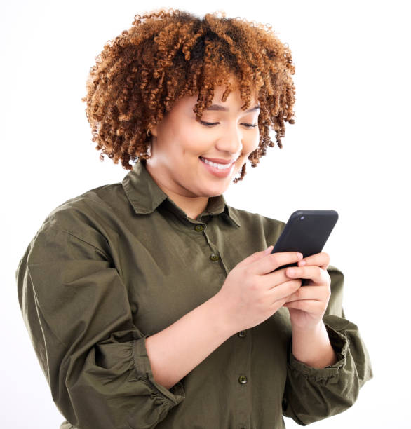 istock Black woman, phone connection and studio with a young model on social media networking app. Online, streaming and web conversation with a African female looking at happy text with a smile on mobile 1493508428