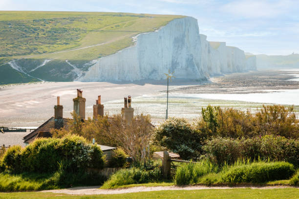 istock Coastguard cottages with Seven Sisters Cliffs in distance at Cuckmere Haven, UK 1493509754