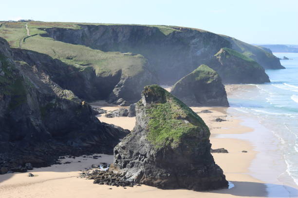 istock Bedruthan Steps, Cornwall, at low tide in sunshine against a clear blue sky 1493514294