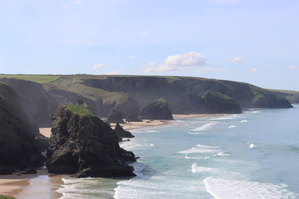istock Bedruthan Steps, Cornwall, at low tide in sunshine against a clear blue sky 1493514354