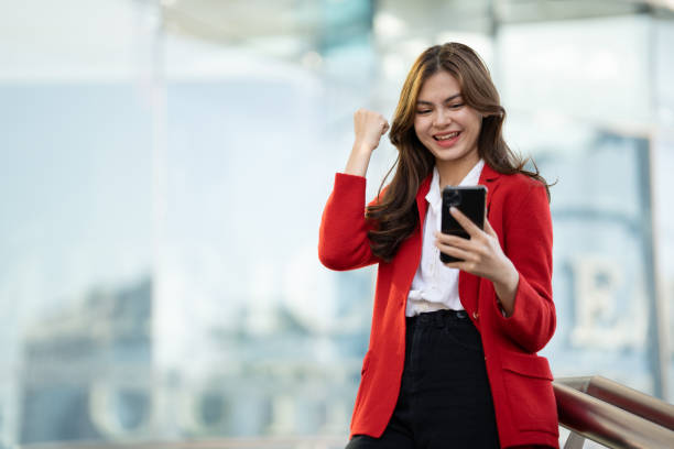 istock Young asian businesswoman using smart phone in office.. 1493518710