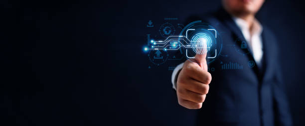 istock Digital thumb fingerprint scanner provides cyber security access with biometrics identification by business person touching screen with finger in background. Technology and two-faction authentication 1493519768