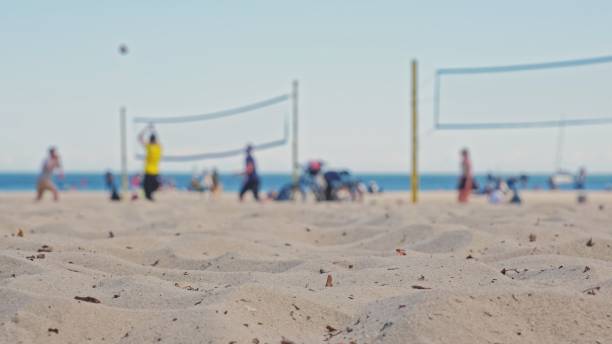 People Playing Beach Volleyball on Hot Sunny Day
