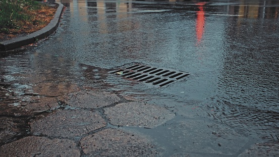 Rain Water Flowing Down Street Storm Sewer Drain Inlet