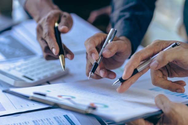 istock Business people meeting explain financial graph data and marketing plan, assess status of business investment and marketing and brainstorm new business project, financial investment concept. 1493524680