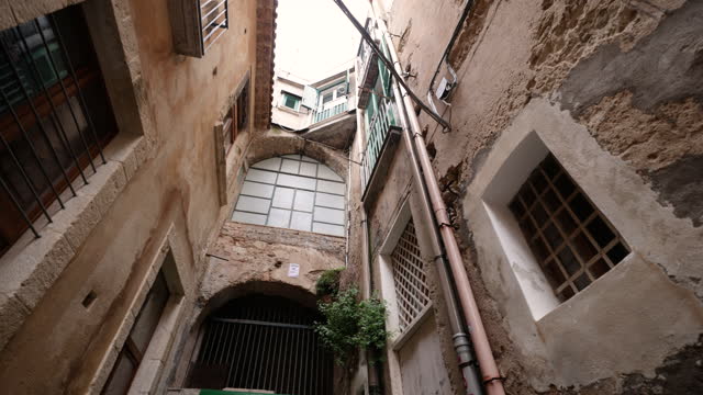 Charming narrow street of an Italian town on a rainy day