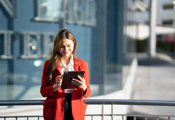 istock Asian business woman with tablet pc in office district. 1493526130