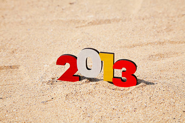 istock Wooden 2013 year number on the sand 149352669