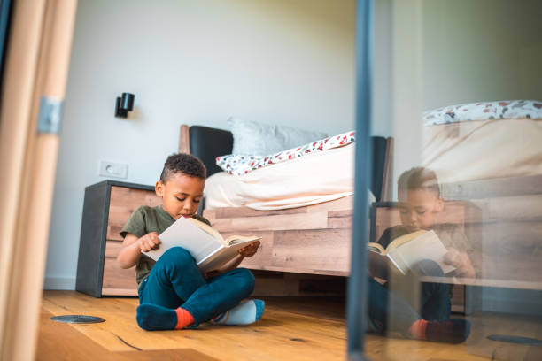 istock Mixed-Race Boy Unleashing Curiosity through Reading 1493527952