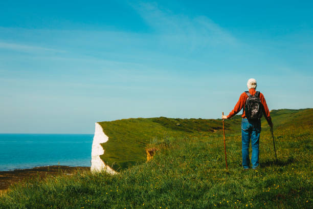 istock Senior male hiking on top of the cliffs 1493529917