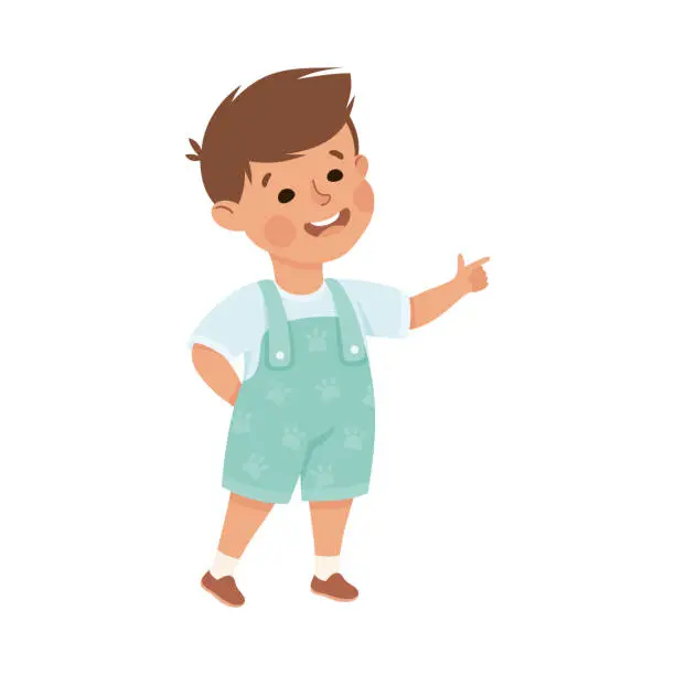 Vector illustration of Little Smiling Boy Standing and Pointing with Index Finger Vector Illustration