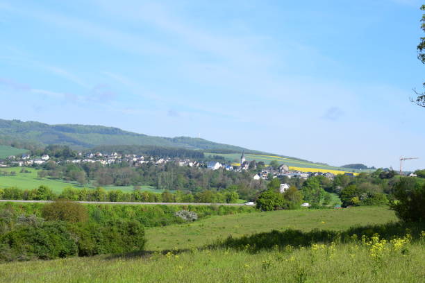 istock green landscape with a village 1493532816