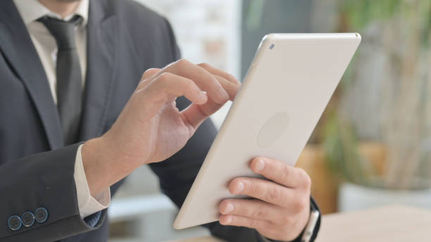 istock Close up of Businessman Hand Using Tablet PC 1493535707