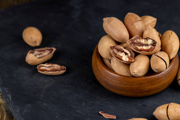 istock Unpeeled crunchy pecans close up 1493535996