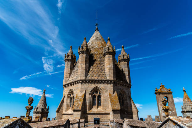 istock Lantern tower of the Cathedral of Evora. Low angle view against blue sky 1493536582