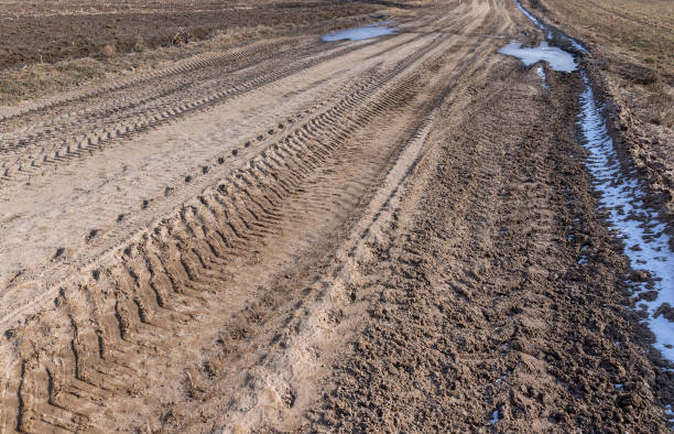 istock a broken country road at the beginning of spring 1493536841
