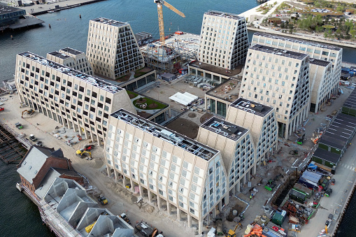 Aerial view of modern architectural construction on a partly reclaimed island inside the old harbour area of downtown Copenhagen, Denmark