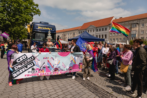 Dessau, Saxony-Anhalt, Germany, Europe - May 20, 2023: LGBTQ+ parade, CSD in Dessau. Christopher street day in Germany. People with rainbow flag.