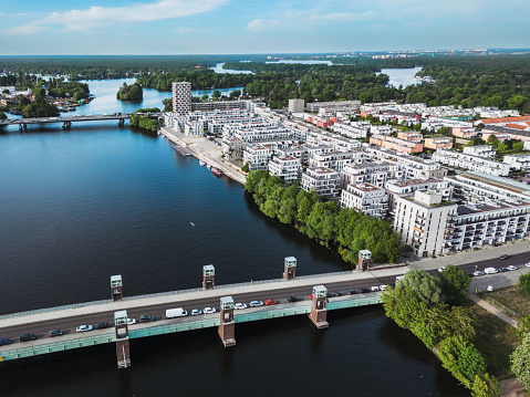 drone view on modern residential district in the Wasserstadt in Berlin with view on the Spandauer Brücke at sunny day