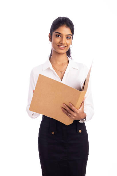 istock Young Indian business woman checking  file 1493545639