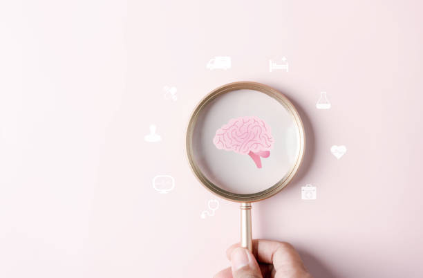 istock Magnifier focus to human brain icon, idea creative intelligence thinking or Awareness of Alzheimer, Parkinson's disease, dementia, stroke, seizure or mental health. Neurology and Psychology care. 1493545721