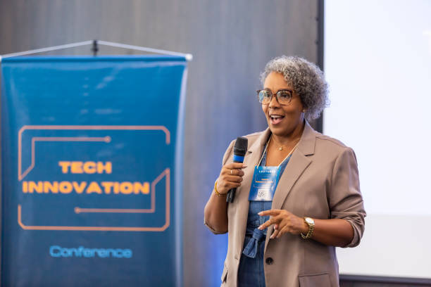 istock Black woman giving talk to business audience 1493549128